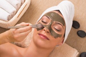 a lady applying face mask